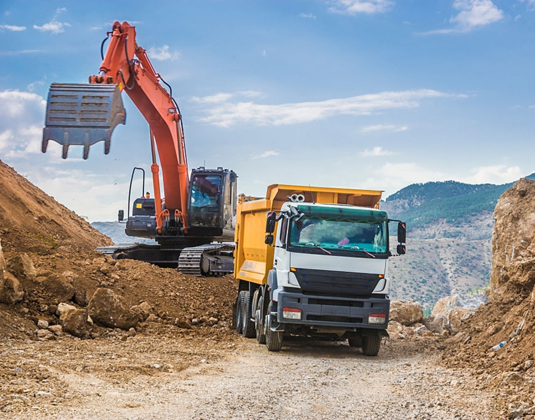 Excavator loading dumper truck